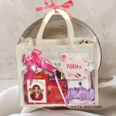 Because my girls deserve the best! A close-up of one of my bridesmaid proposal hampers, packed in a cute jute bag with a personalized tag for Nikita.