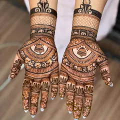 A beautiful and modern design featuring a central bell motif on the palm. The back of the wrist has a bold, dark band, creating a striking contrast with the delicate patterns.