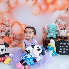 Meeska Mooska Mickey Mouse. This little girl is surrounded by her favorite characters in our fun and playful studio setup.