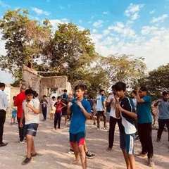 A group of young participants learning the basic fighting stance at our free kickboxing camp. We focus on building a strong foundation, teaching proper form and balance from the very first lesson.