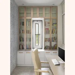 This is the final look of the study nook, built around a window to maximize natural light. The floor-to-ceiling library provides ample book storage, with a mix of glass-fronted and closed cabinets in a two-tone finish.