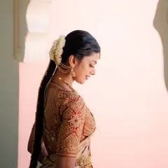 A view of the intricate back and sleeve embroidery on this custom bridal blouse. I focus on ensuring every angle is picture-perfect, using traditional zardosi techniques for a rich, luxurious finish.