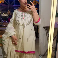 A mirror selfie showing my full ethnic outfit. The makeup was focused on creating a radiant, flawless complexion that would complement the intricate silver and pink embroidery on my suit.