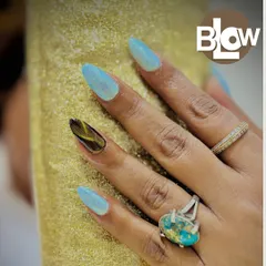 I love creating unique accent nails. Here, I paired a shimmery, light blue polish with a custom, hand-painted tortoiseshell design on the ring finger for a truly one-of-a-kind manicure.