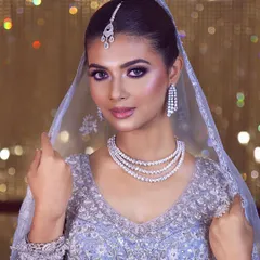 The glow-up for my 'happily ever after' has begun. This modern bridal look with purple smokey eyes and diamond jewelry is absolutely stunning.