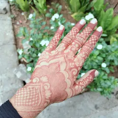 This is the beautiful, rich reddish-brown stain that develops after the henna paste is removed. I only use 100% organic henna that I mix myself to ensure you get this gorgeous, natural, and safe result every time.