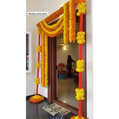 I provide beautiful and traditional decor for at-home pre-wedding ceremonies. This Haldi and Mehendi entrance decor uses bright marigold garlands to create a festive and welcoming toran for your guests.