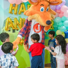 Surrounded by adoring fans! J the Fox is the center of attention during a birthday party celebration.
