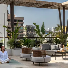This shot captures a moment of tranquility on the spacious terrace. It's a space designed for pause and gathering, balancing the energy of the city with the calmness of a private retreat.