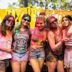 A group of friends posing together, covered in Holi colors. Our festivals are all about creating fun, shareable moments with the people you care about.