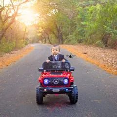 Hitting the road in style for a first birthday. This outdoor shoot captures the adventurous spirit of a one-year-old with beautiful, golden-hour light creating a cinematic feel.