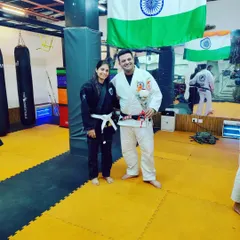 It is an honor to train with legends in the field. Here I am with a fellow practitioner after a great Jiu-Jitsu session, wearing my Gi and ready for the next roll.