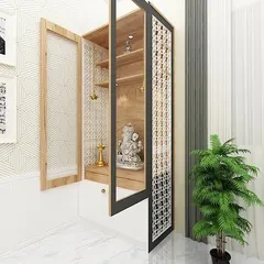 Another view of the modern pooja unit, showing the detailed jali work on the doors which allows light to filter through, creating a peaceful ambiance.