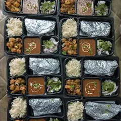 A large order of Dal Makhni thalis ready to be dispatched. Each thali is carefully packed to ensure it reaches the customer fresh and hot.