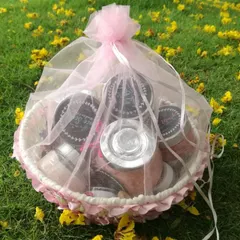 A lovely gift basket of my skincare products, wrapped in pink tulle. This makes a perfect present for someone who deserves a little pampering.