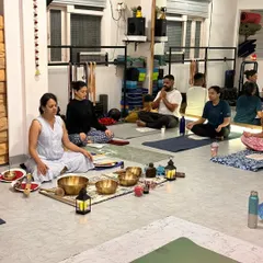 A wider view of our sound bath session, with participants settled in for an evening of chanting and healing vibrations.