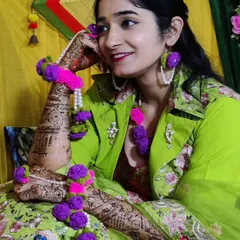For the bride-to-be who wants something truly unique. I designed and created this custom crochet floral jewelry set for a mehndi ceremony. The set includes a maang tikka, earrings, and hathphool bracelets, all handmade with vibrant purple and pink yarn and detailed with pearls.