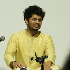 Deep in concentration during a complex rhythmic cycle. A solo performance is a test of focus, stamina, and creativity, all learned through years of dedicated riyaz.