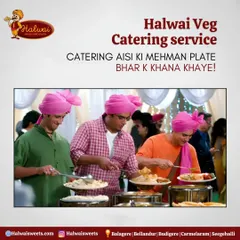 We believe in catering that makes your guests feel cherished. This image of guests enjoying our wedding buffet, complete with traditional pink turbans, captures the joy and satisfaction we aim to provide.