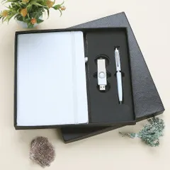 An elegant shot of a white corporate gift set in its packaging, styled with subtle decorative elements to create a premium feel for a corporate catalogue.