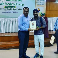 Receiving a token of appreciation after a wonderful Ayurveda and yoga medical camp at the IOCL Pipelines Head Office in Noida.