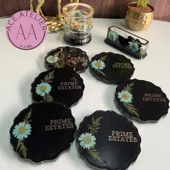 The final customized desk set for 'Prime Estates'. The black resin with preserved blue daisies and gold leaf creates a sophisticated and branded look, perfect for a corporate office.