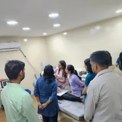 This image captures the collaborative environment of my training sessions. A group of dedicated dermatologists observes a live demonstration, fostering a space for shared learning and in-depth discussion on advanced aesthetic applications.