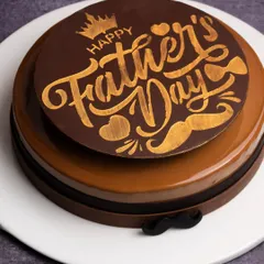A special cake designed just for Father's Day. This coffee and chocolate creation has a rich, glossy finish and is topped with a custom "Happy Father's Day" chocolate plaque.