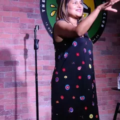 A shot of me mid-performance in Singapore. I love the energy of international audiences and the challenge of making people from different backgrounds laugh together.