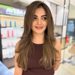 Face-framing baby lights are a perfect way to brighten your look. This technique adds subtle, sun-kissed highlights around the face for a natural glow.