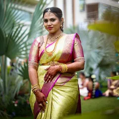 Our beautiful bride in her complete wedding attire, showcasing the elegant pairing of her silk saree and our custom-fit embroidered blouse.