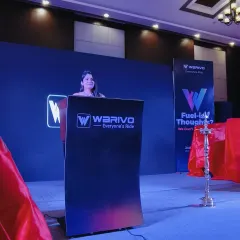 The stage is set for a big reveal. Here I am at the product launch for Warivo's new electric scooters, building anticipation before the unveiling.