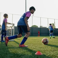 The whistle blows and the fun begins. A young player starts a dribbling exercise, building confidence and control with every touch. Our sessions are filled with dynamic drills that feel like games.