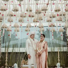 A unique mandap design featuring a ceiling of hundreds of hanging wicker bells. This created a beautiful textured look for a traditional ceremony, blending rustic elements with classic elegance.