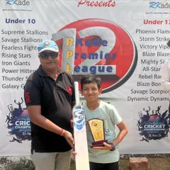 A moment of pride. A young player from the Supreme Stallions team receives his award during the RKade Premier League ceremony. Recognizing effort is a key part of our culture.