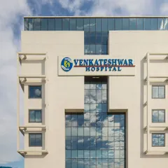A close-up of the Venkateshwar Hospital facade, reflecting the sky in its large glass panels. This IGBC Gold-rated project demonstrates our commitment to sustainable and modern healthcare design.