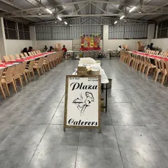 Our setup at RR Party Hall in Maddur, ready for the event to start. You can see our branded sign at the entrance, with the dining area neatly arranged in the background.