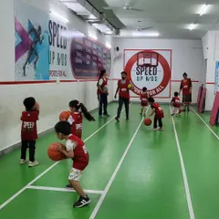 A basketball training session in full swing. Even our youngest players get to learn how to handle the ball. Our coaches provide hands-on guidance to each child.