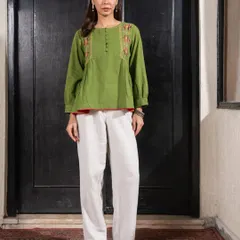 This Paheli green top, paired with white pants, offers a comfortable and stylish look. The hand embroidery and relaxed fit make it a versatile piece for mixing and matching.