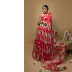The gown's voluminous skirt and flowing dupatta create a dramatic and unforgettable silhouette.