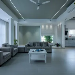 You can never go wrong with grey. This expansive living room uses a sophisticated grey palette, with clean lines and ample natural light creating a calm and modern atmosphere.