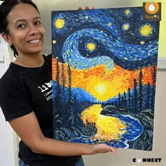 A student proudly displays her vibrant recreation of Van Gogh's 'Starry Night'. Our acrylic painting classes help you explore famous art movements and develop your own style, turning a blank canvas into a personal masterpiece.