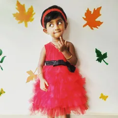 Another adorable pose from Pari. I focus on creating kids' party dresses that are not only beautiful but also allow them to move, play, and express their personalities.