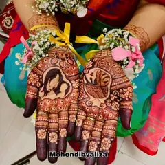 The beautiful henna stain on a baby shower design. The portraits of the mother and baby are so clear and heartwarming.