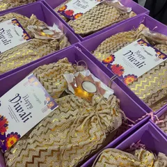 A closer look at a customized corporate order. We included personalized "Happy Diwali" cards from the client, Newgen, along with our handcrafted treats and festive diyas. These small, thoughtful details make each corporate hamper feel special.