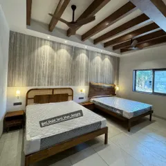 A hotel room project showcasing two of my custom bed designs. On the left, a mid-century style with a cane headboard, and on the right, a bed with a stunning live-edge solid wood headboard.