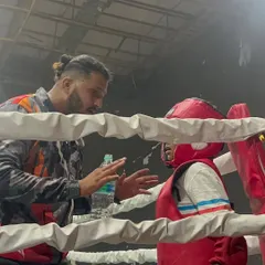 In the heat of competition, guidance is everything. I am in my fighter's corner during the IFMA National Championships, making sure they are focused, hydrated, and ready for the next round.