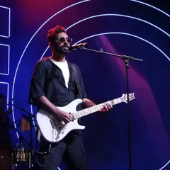 The guitarist of Sanam Band on stage, with our custom neon light design creating a dynamic and energetic concert atmosphere.