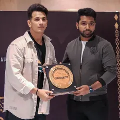 Receiving the Gold Era Award for Best Fashion Photographer in 2022 from Prince Narula.
