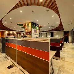 From this perspective, you can see the modular workstations arranged around the central design feature. The layout is designed for collaboration while the custom color palette on the partitions adds energy to the workspace.